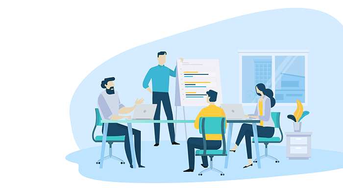 Team of startup professionals discussing growth strategy in a meeting room, with charts and laptops during a business presentation.