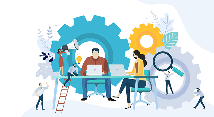 Startup team collaborating on laptops surrounded by gears, symbolizing teamwork, innovation, and business process development